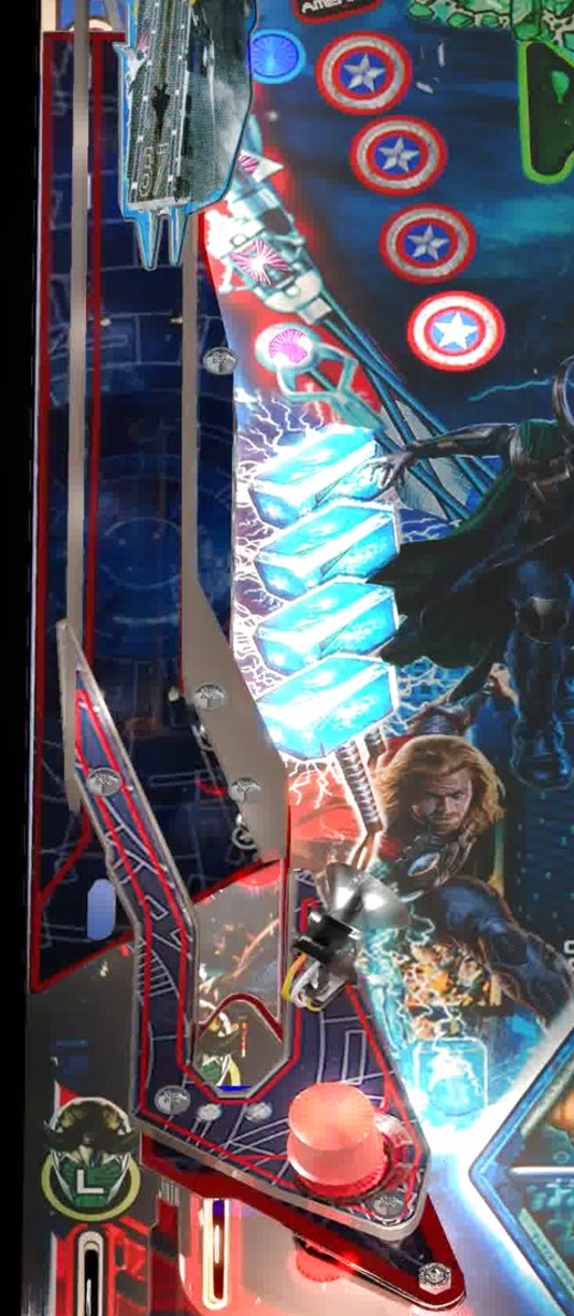 The four blue Thor standup targets on the left side of the installed playfield