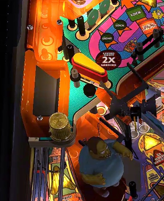 Comic Book Guy toy marks this area; the standup is obscured below it.