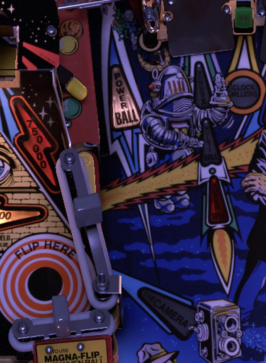 The Camera sinkhole behind the small upper-left flipper, marked CAMERA, on the installed Twilight Zone playfield