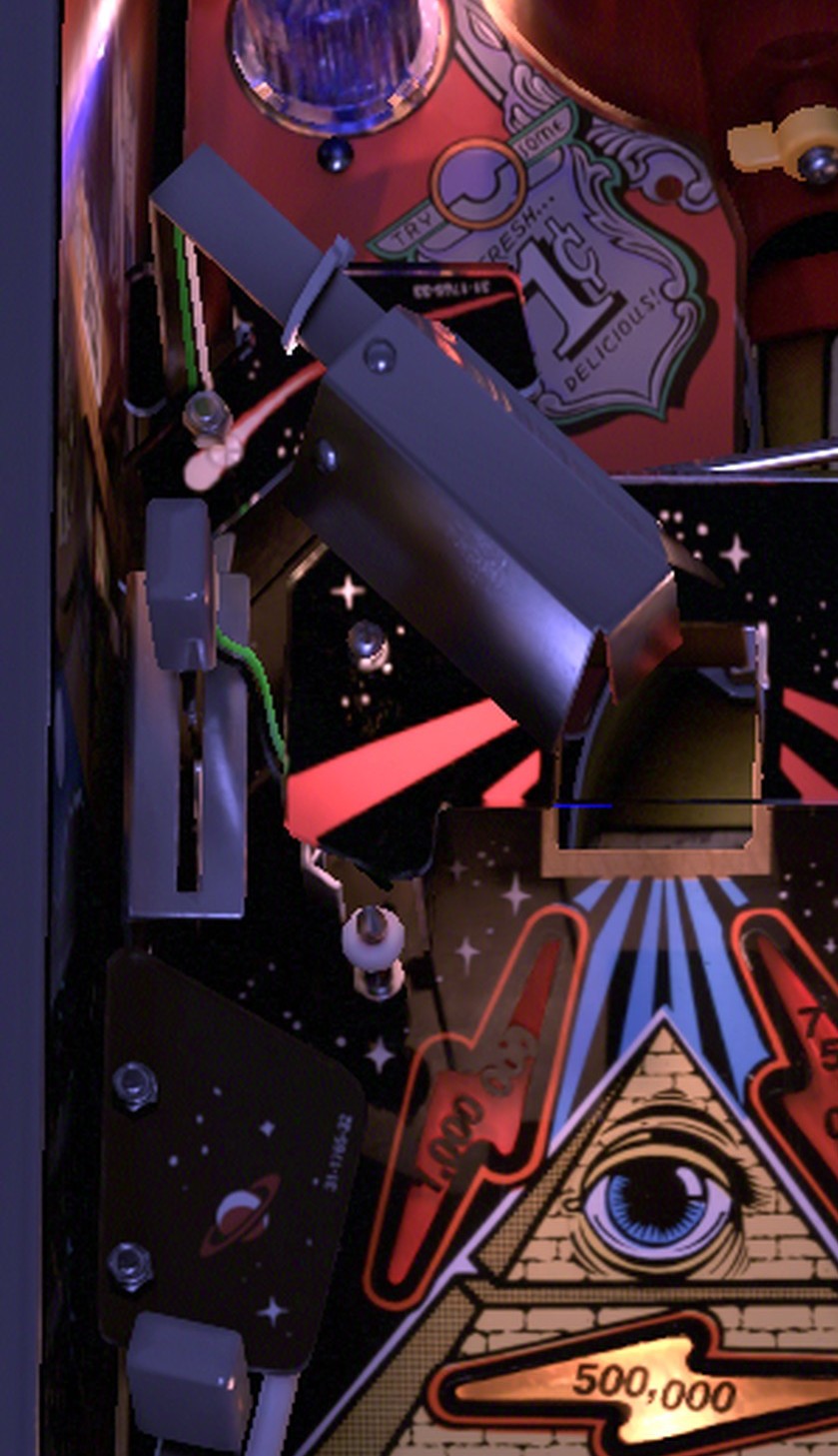 The small Dead End sinkhole on the far left edge, above the jet bumpers and under the Powerfield, on the installed Twilight Zone playfield