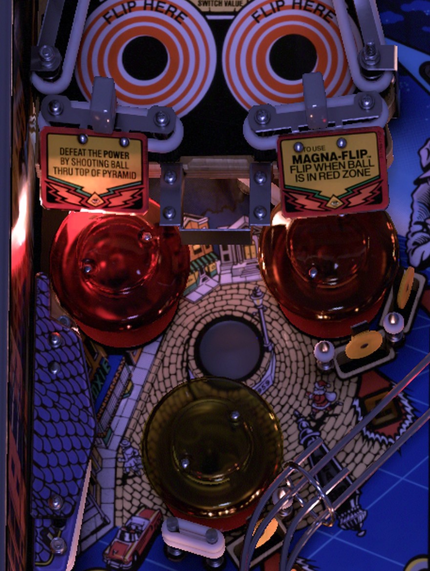 The three jet bumpers in the lower-left corner with the Hitchhiker Lane just above them on the installed Twilight Zone playfield