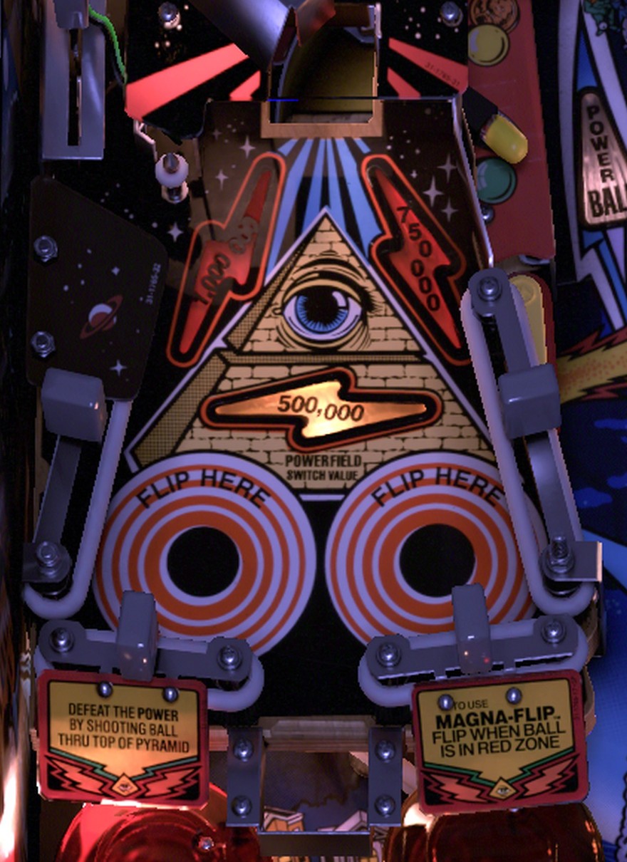The raised pyramid Powerfield with the eye and FLIP HERE corners on the left side of the installed Twilight Zone playfield