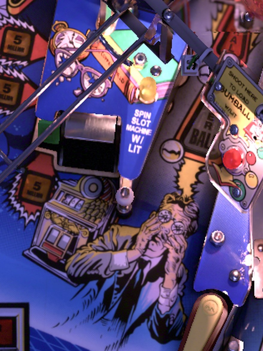The Slot Machine scoop above the upper-right flipper with the SPIN SLOT MACHINE sign on the installed Twilight Zone playfield